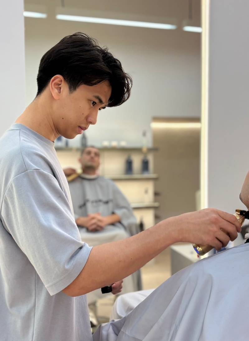Expert grooming specialists at TWENTY.TWO CUT Bangkok – professional barbers and stylists for men