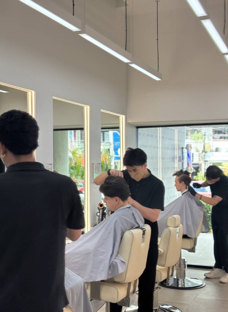 Expert grooming specialists at TWENTY.TWO CUT Bangkok – professional barbers and stylists for men